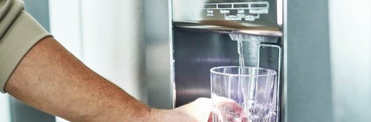 Filling a class with water from a refrigerator 